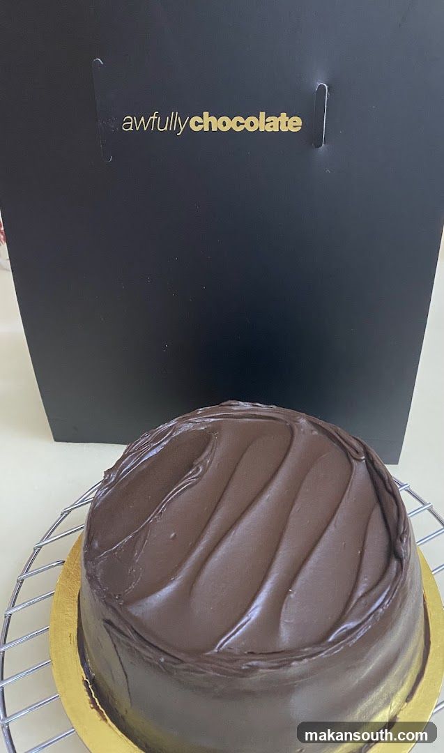 Chocolate cake with "awfullychocolate" bag