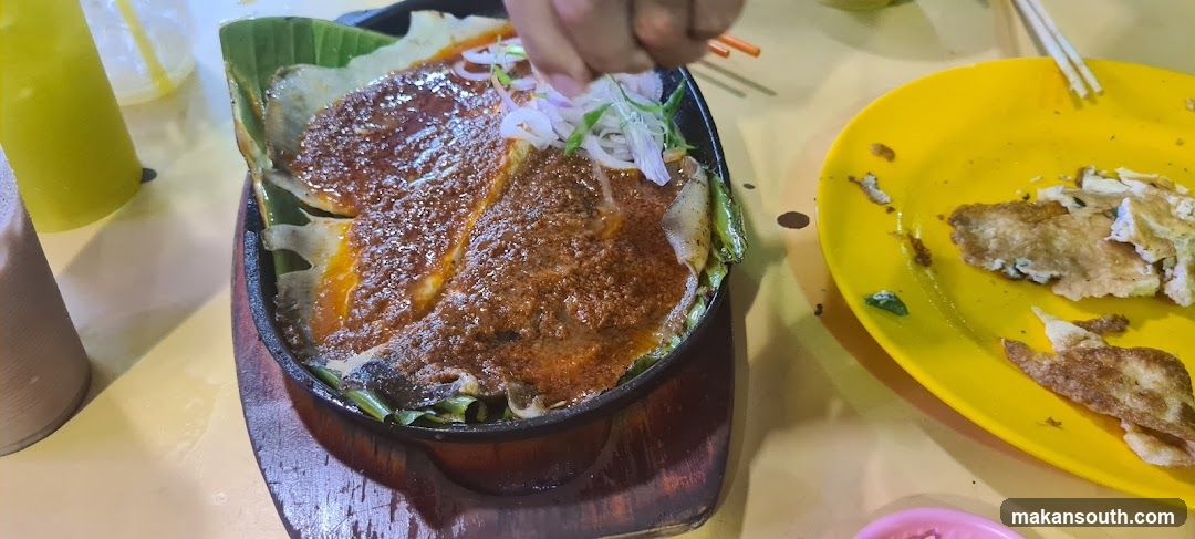 Sizzling Dish with Sauce and Onions
