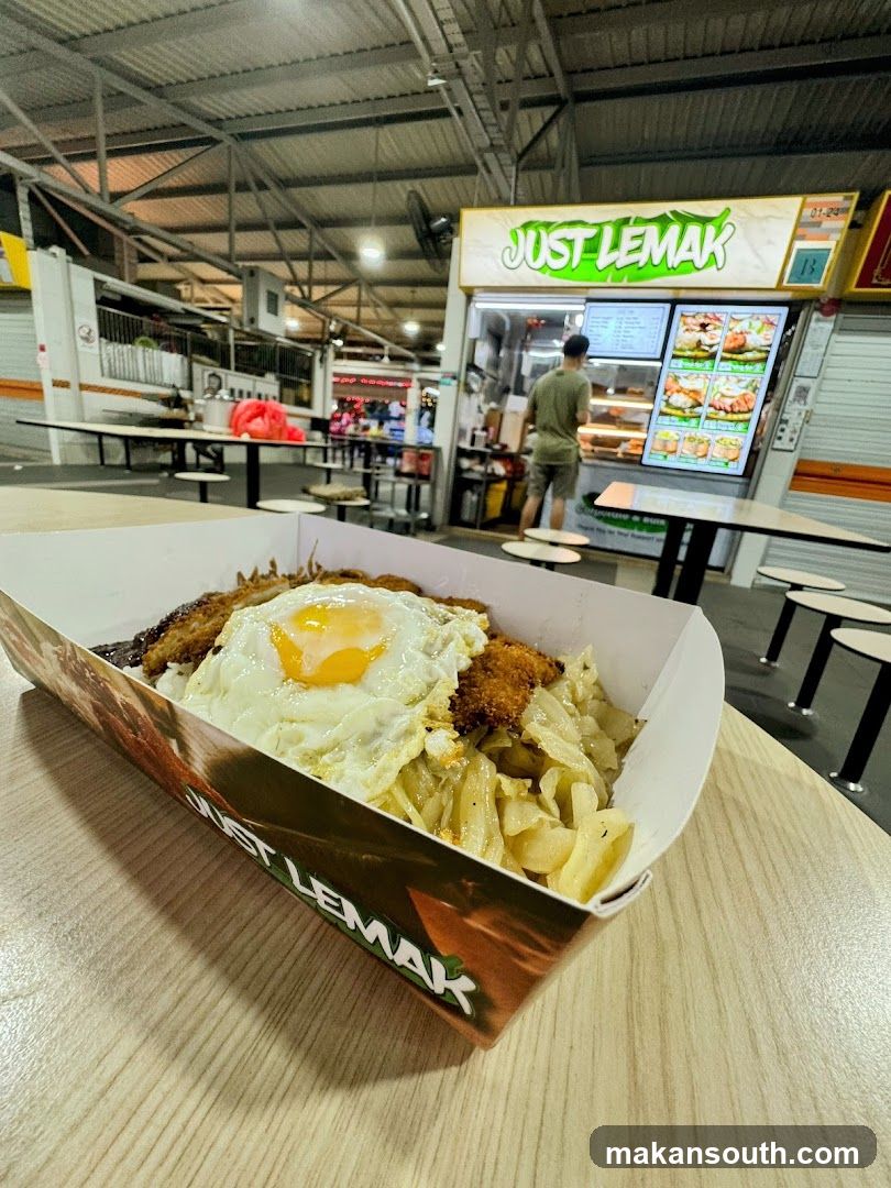 Food container with fried egg and rice
