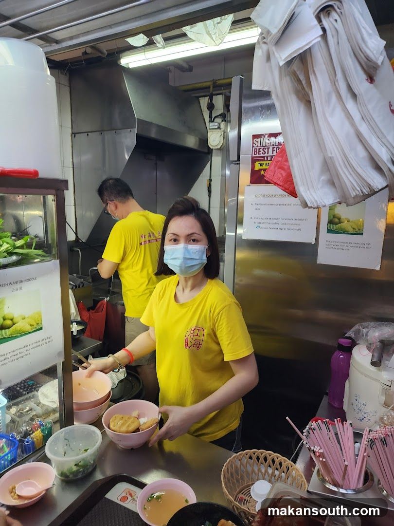 Food Stall Staff Preparing Meal