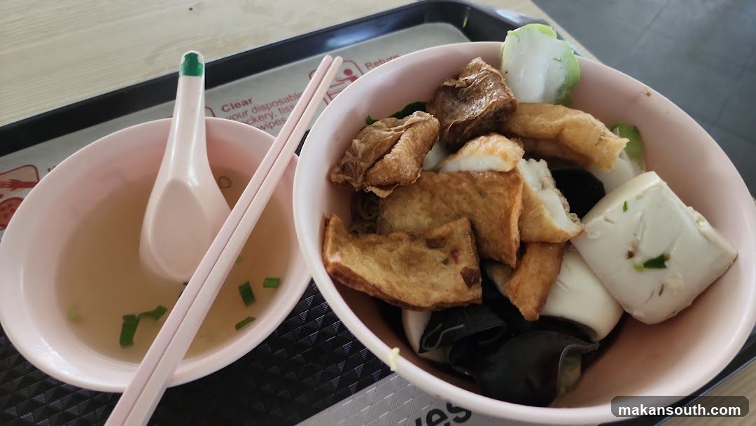 Bowl of noodles with various toppings