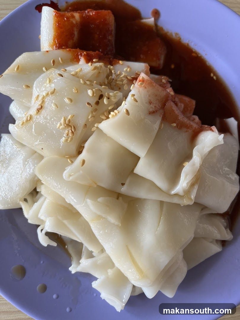 Chee Cheong Fun with Sauce and Sesame Seeds