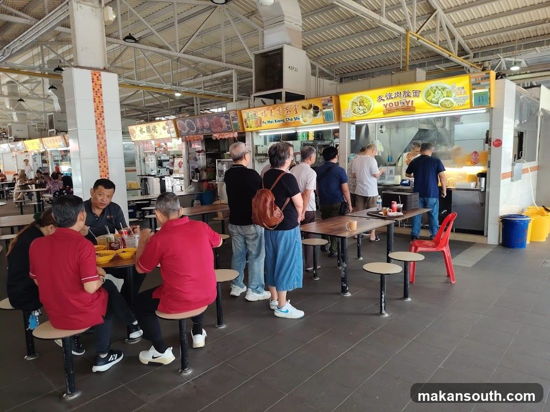 Food court with people eating and ordering