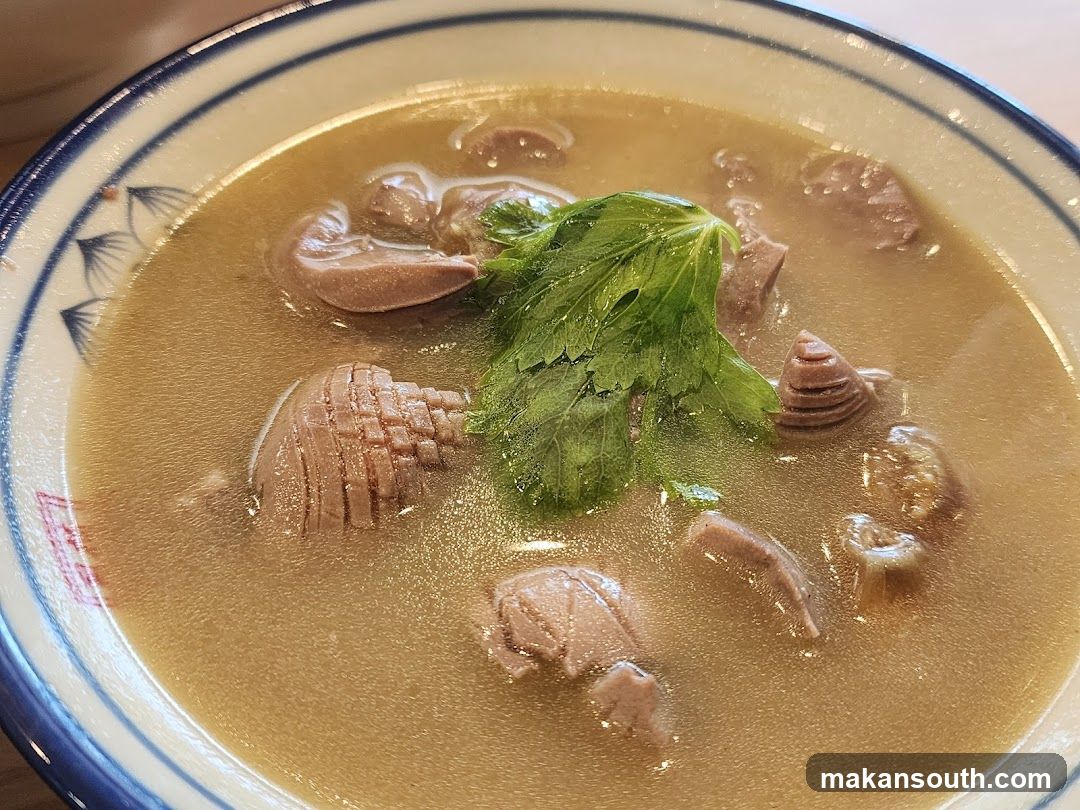 Bowl of Soup with Meat and Greens