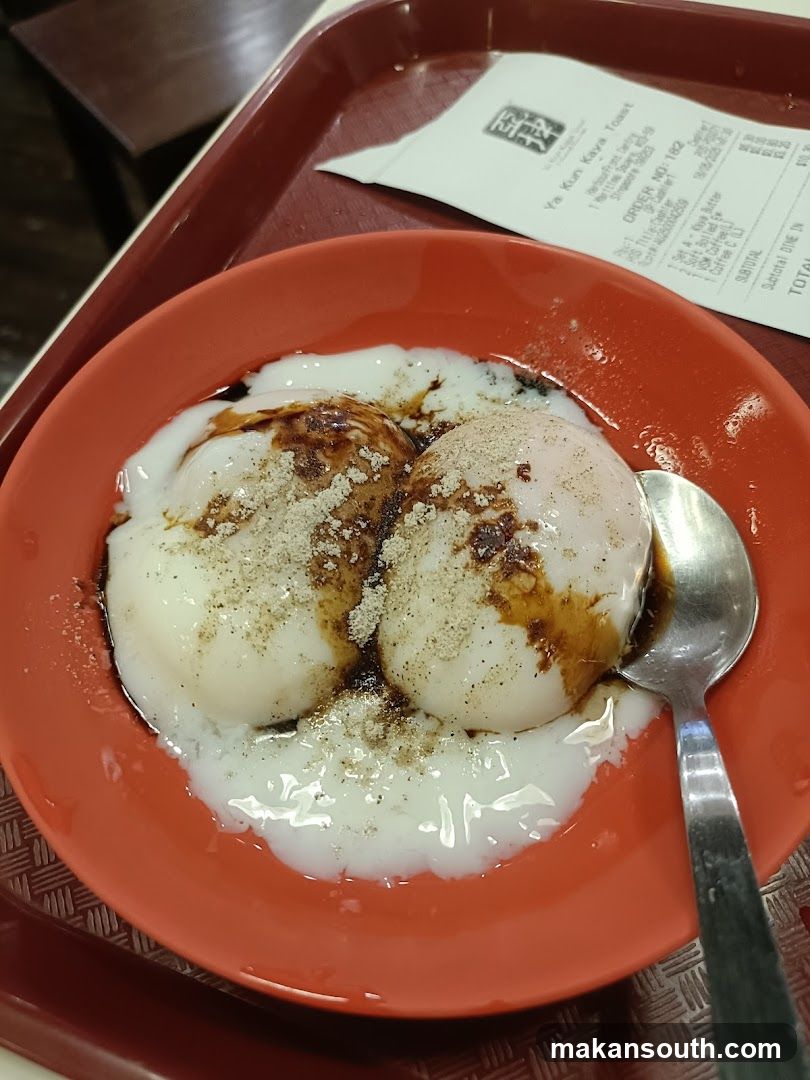 Soft boiled eggs with soy sauce and pepper