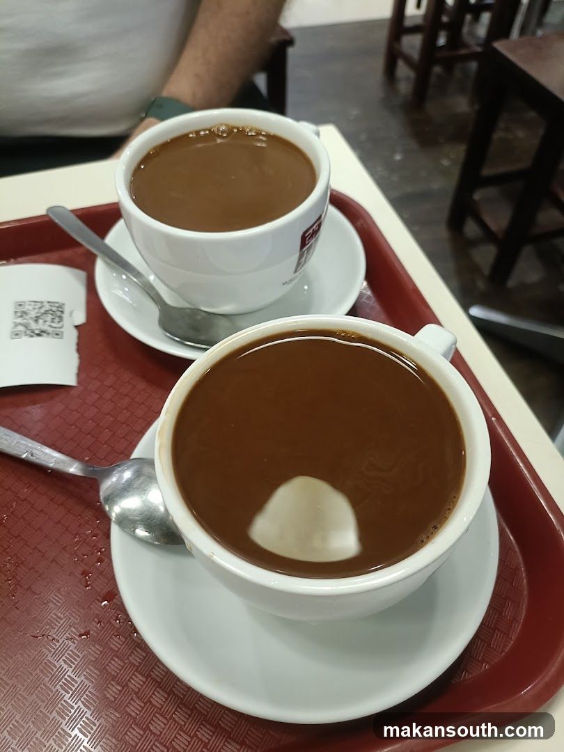 Two cups of coffee on a tray