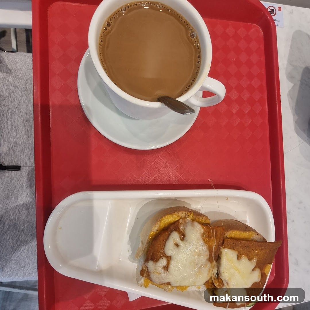 Coffee and sandwich on a tray