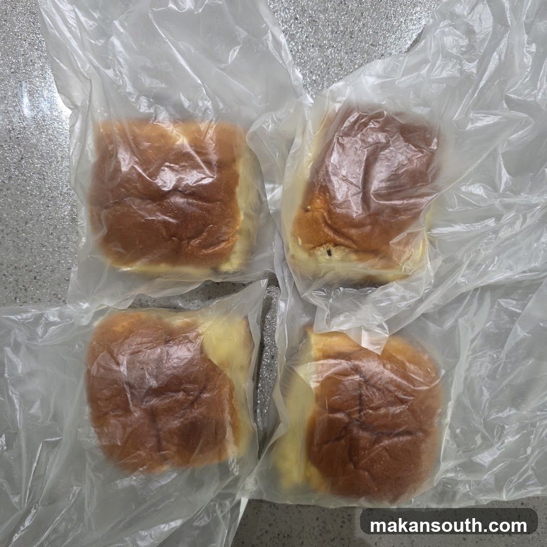 Four buns in plastic packaging