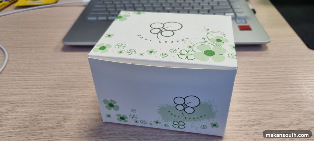 Box with "Four Leaves" logo