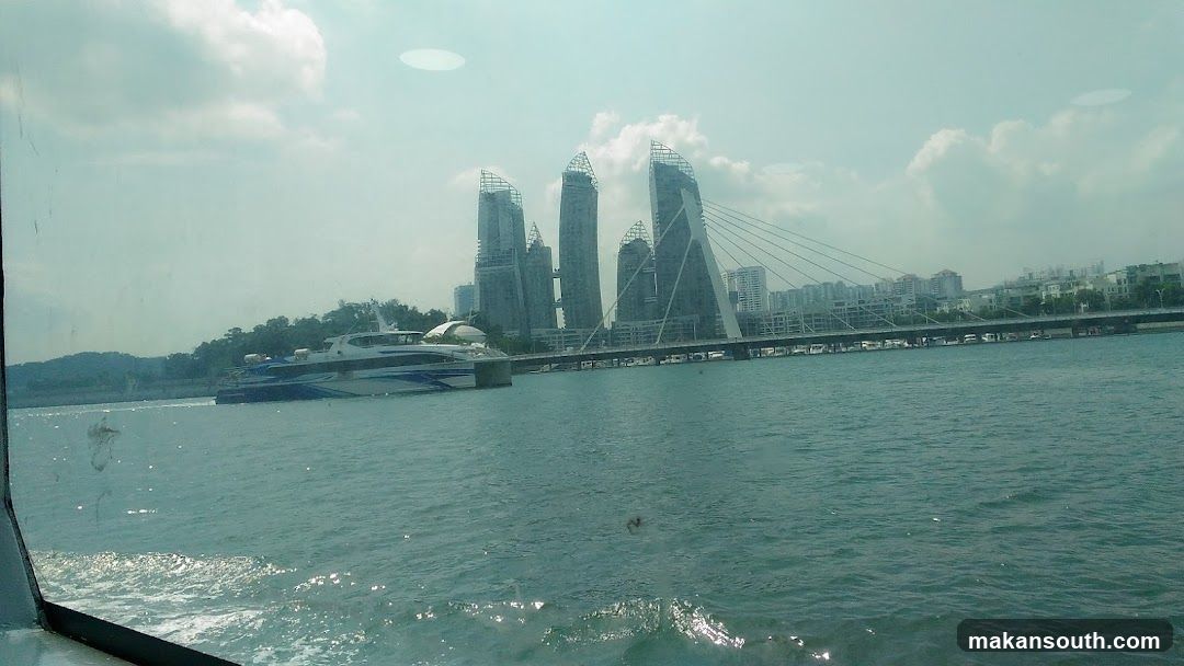 Modern Cityscape with Waterway and Yacht