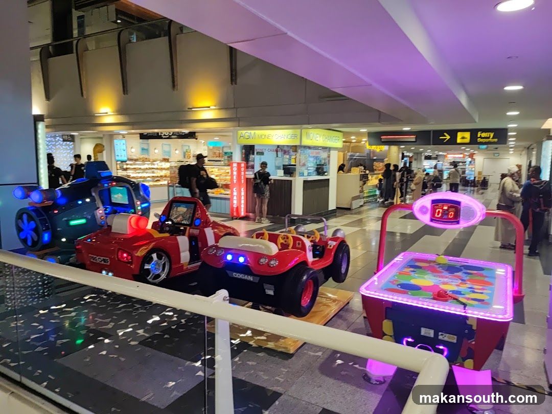 Amusement rides and arcade game in a public area
