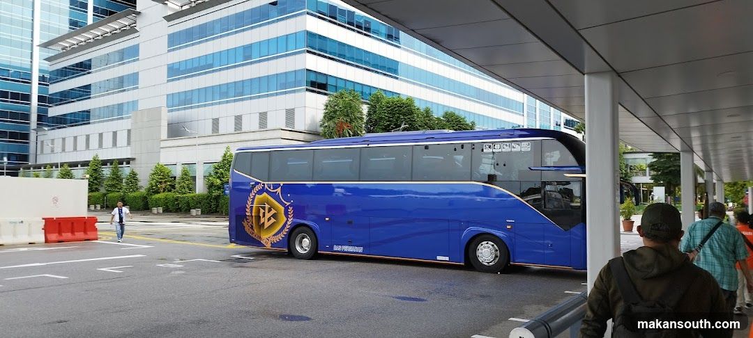Blue Bus at Modern Building