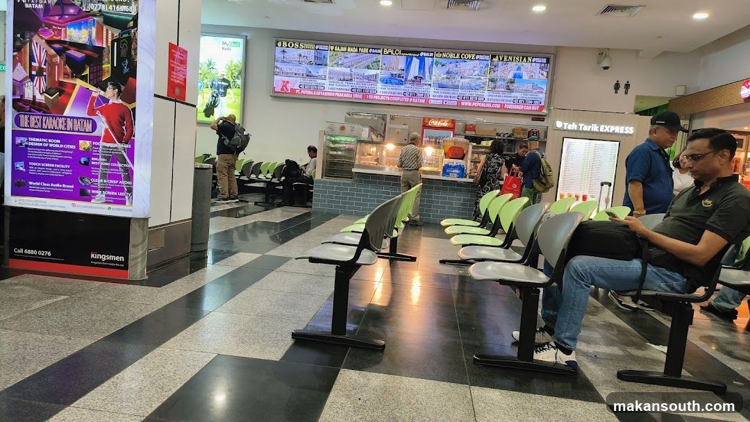 Waiting Area with Food Stalls and Advertisements