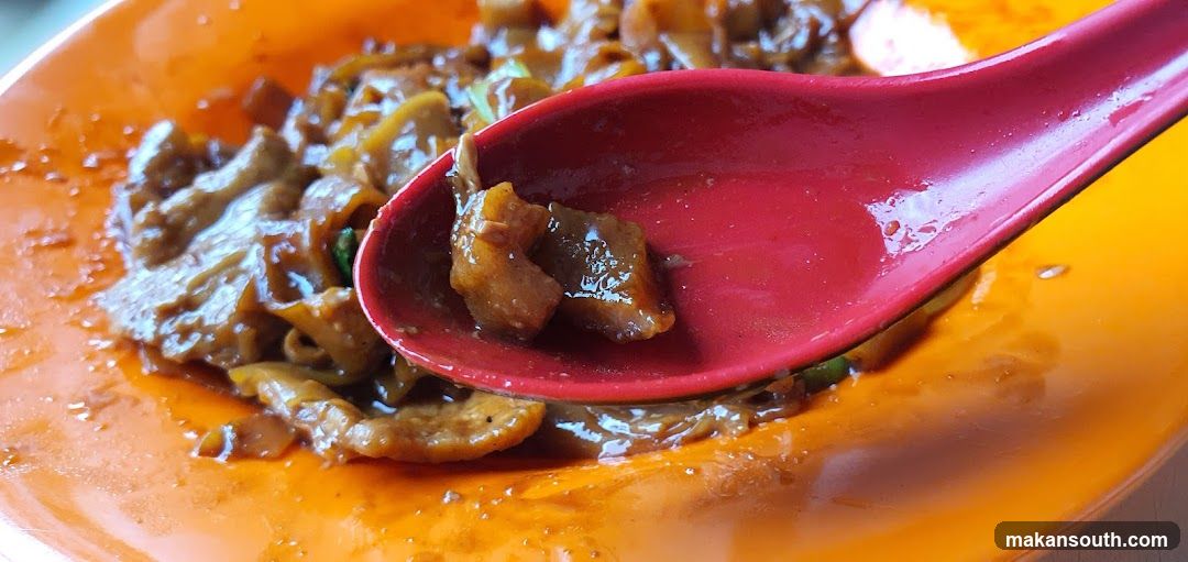 Close-up of Noodles with Meat on a Spoon