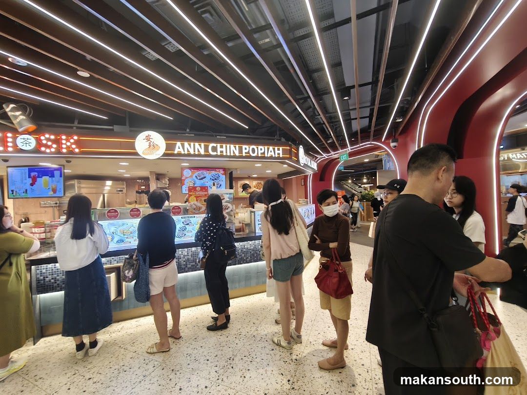 People queuing at a food stall