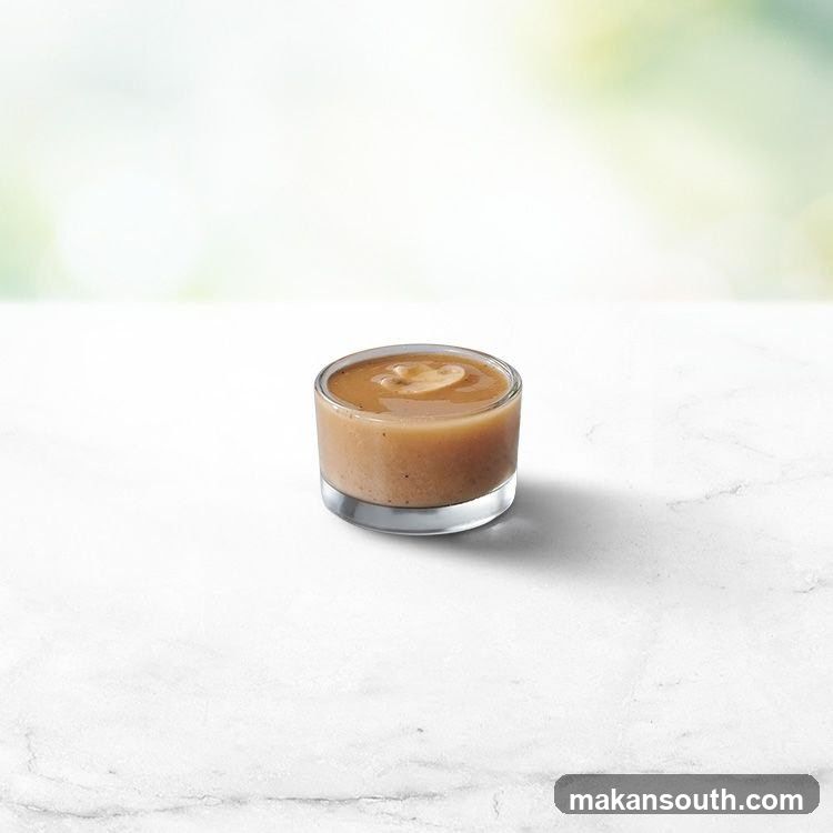 Gravy in a small glass dish