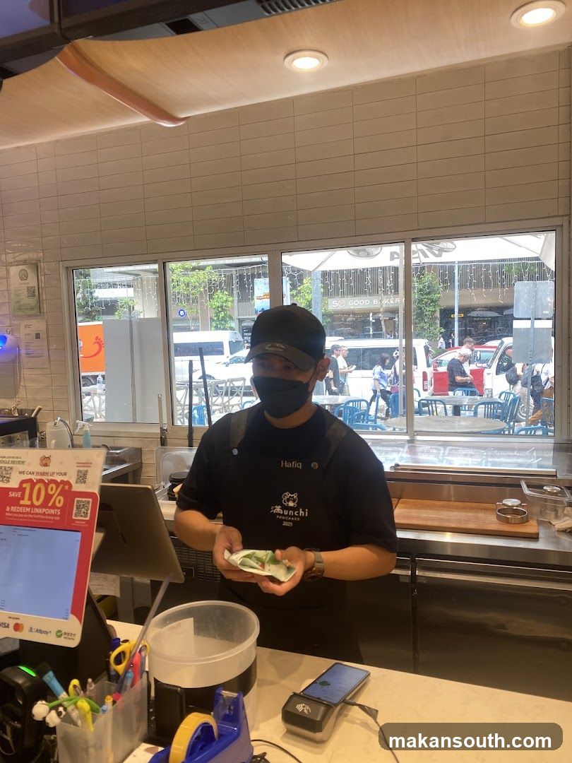 Staff member holding food item