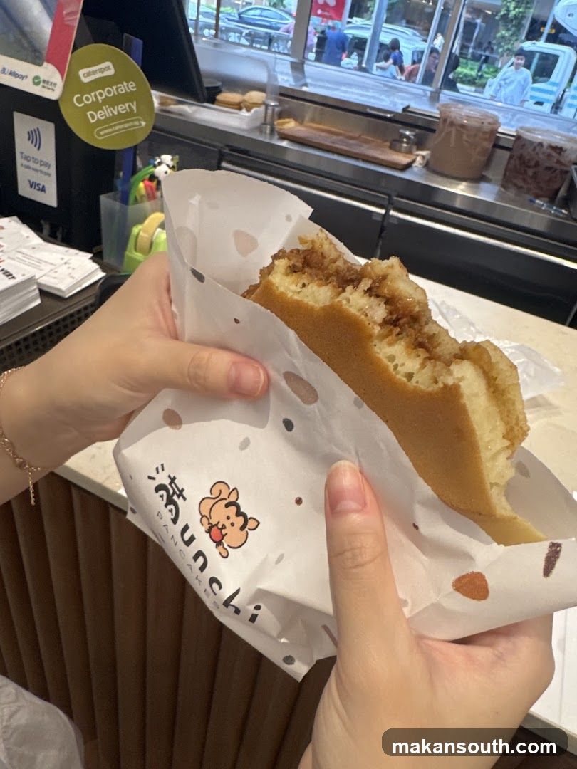 Pancake being held in paper wrapper
