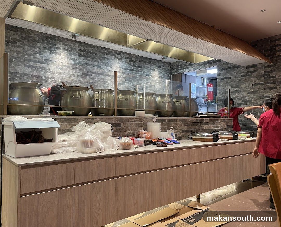 Kitchen Counter with Pots and Staff