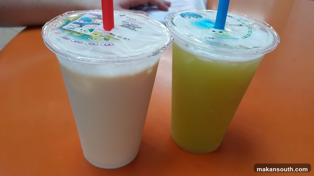 Two drinks on an orange table