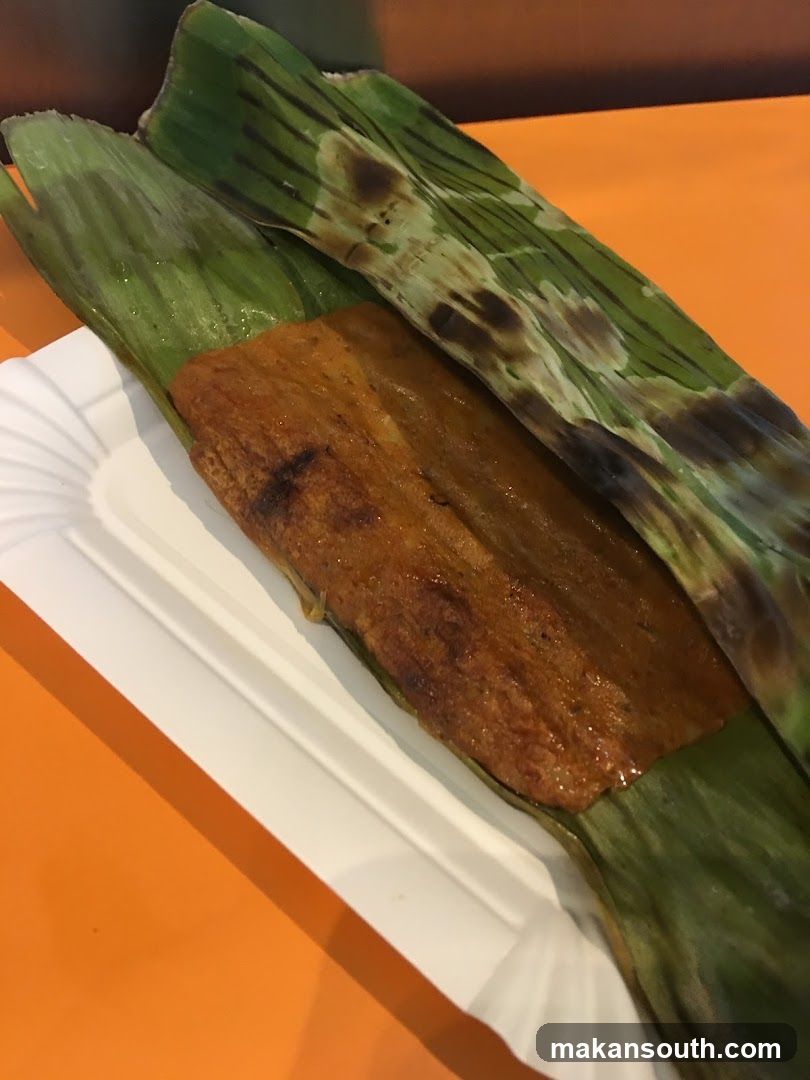 Food item wrapped in banana leaves