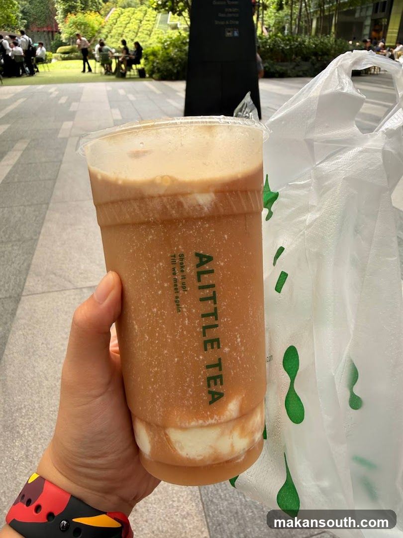 Drink with "A LITTLE TEA" logo