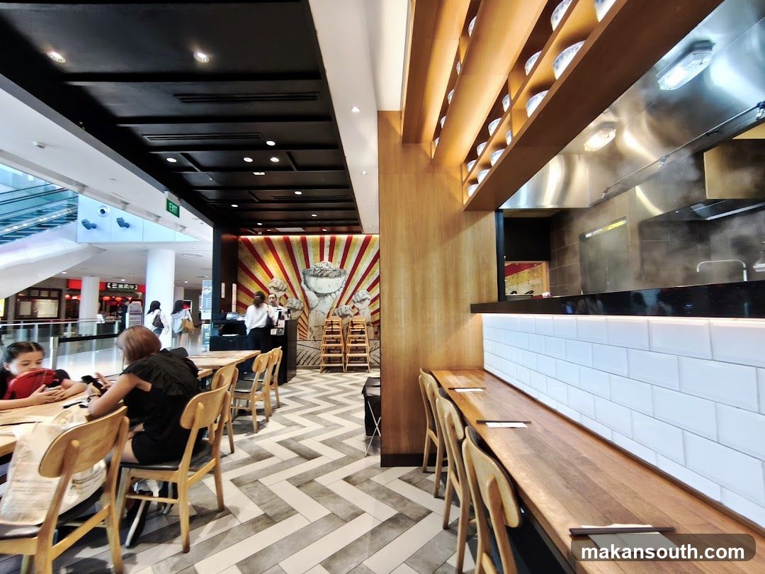 Restaurant Interior with Dining Area and Kitchen View