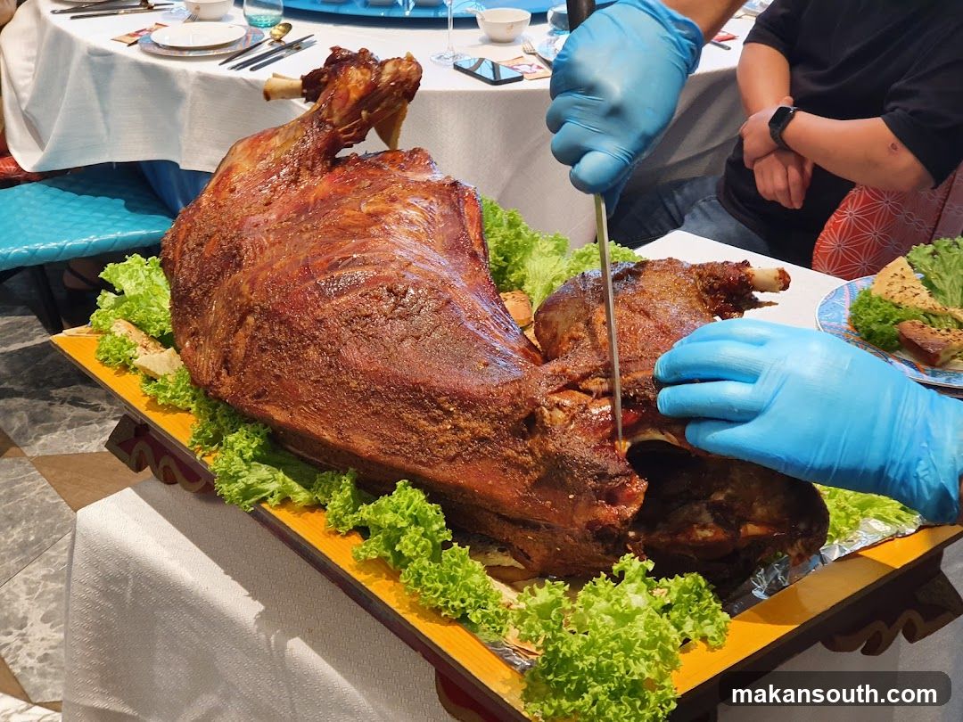Whole Roasted Lamb Being Carved