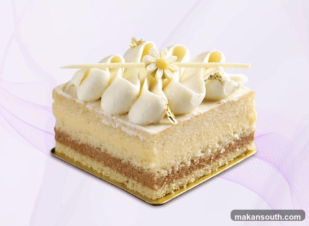 Layered Cake with White Frosting and Flower Decoration