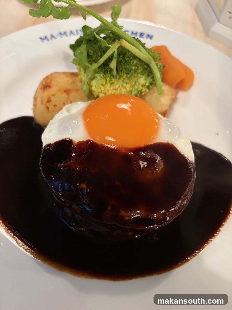 Hamburger steak with fried egg and vegetables