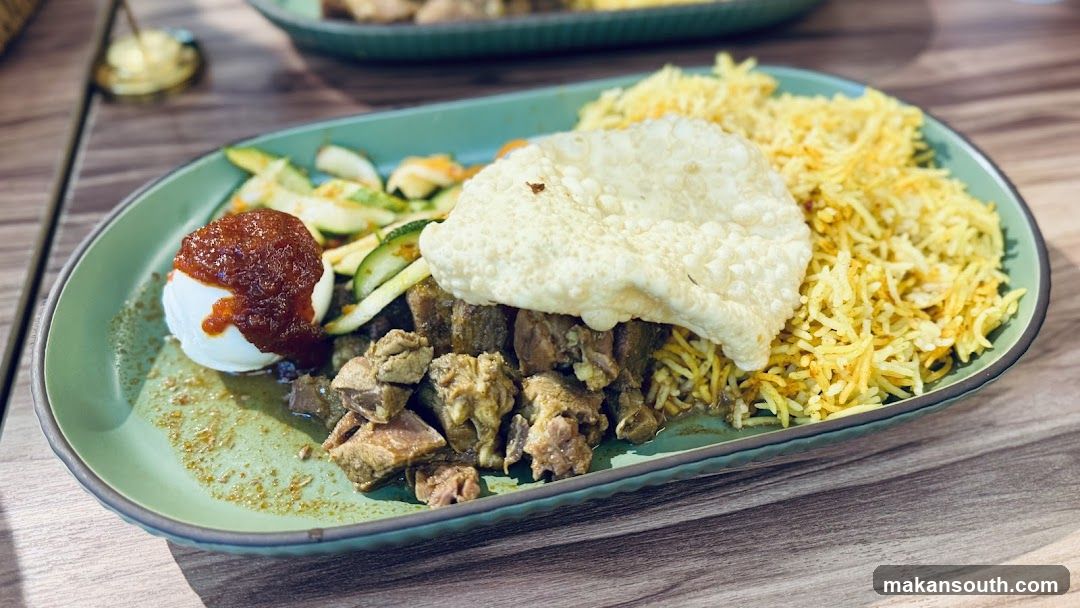 Lamb dish with rice and salad