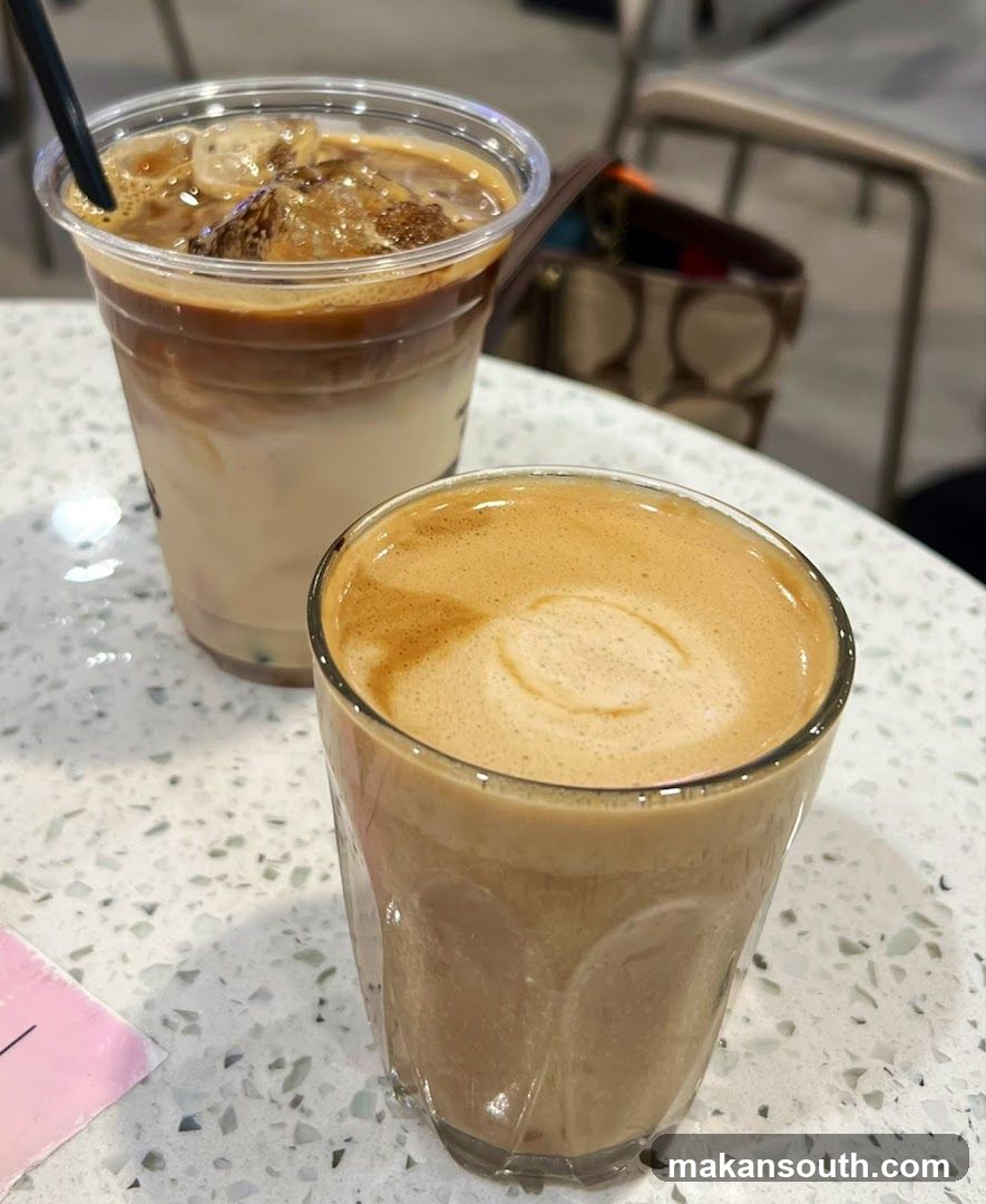 Two coffee drinks on a table