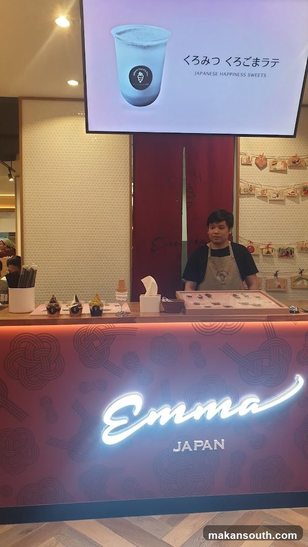 Dessert shop counter with staff