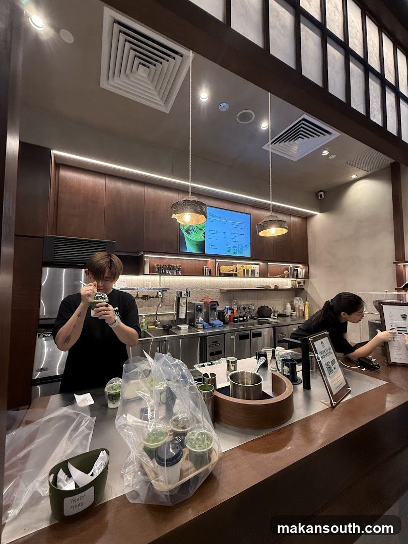 Baristas preparing drinks at a counter