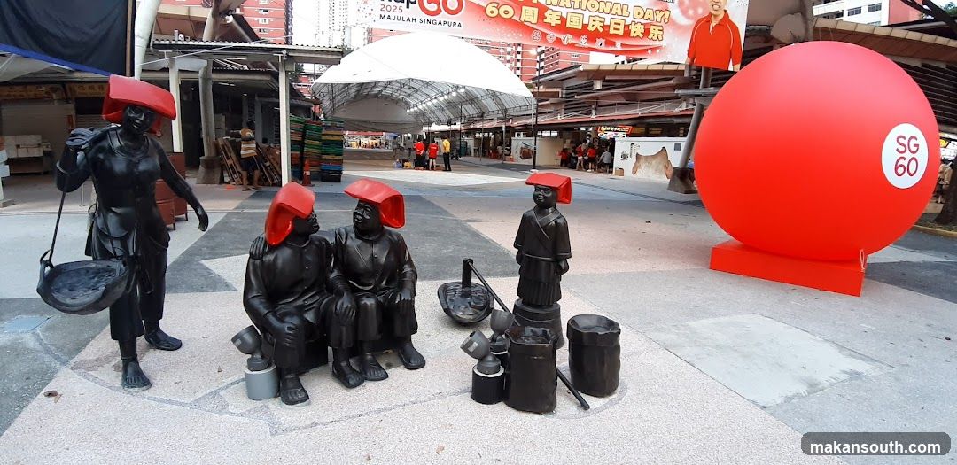 Outdoor Market Scene with Sculptures and Decorations