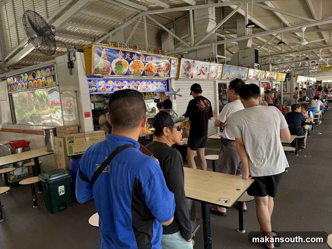 Food court with many stalls and diners
