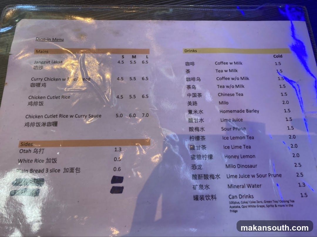 A menu with Mains, Sides, and Drinks sections. Mains include Janggut Laksa, Curry Chicken w Rice/Bread, Chicken Cutlet Rice, and Chicken Cutlet Rice w Curry Sauce. Sides include Otah, White Rice, and Plain Bread. Drinks include various coffee and tea options, Milo, Homemade Barley, Lime Juice, Sour Prune, Ice Lemon Tea, Ice Lime Tea, Honey Lemon, Milo Dinosaur, Lime Juice w Sour Prune, Mineral Water, and Can Drinks.