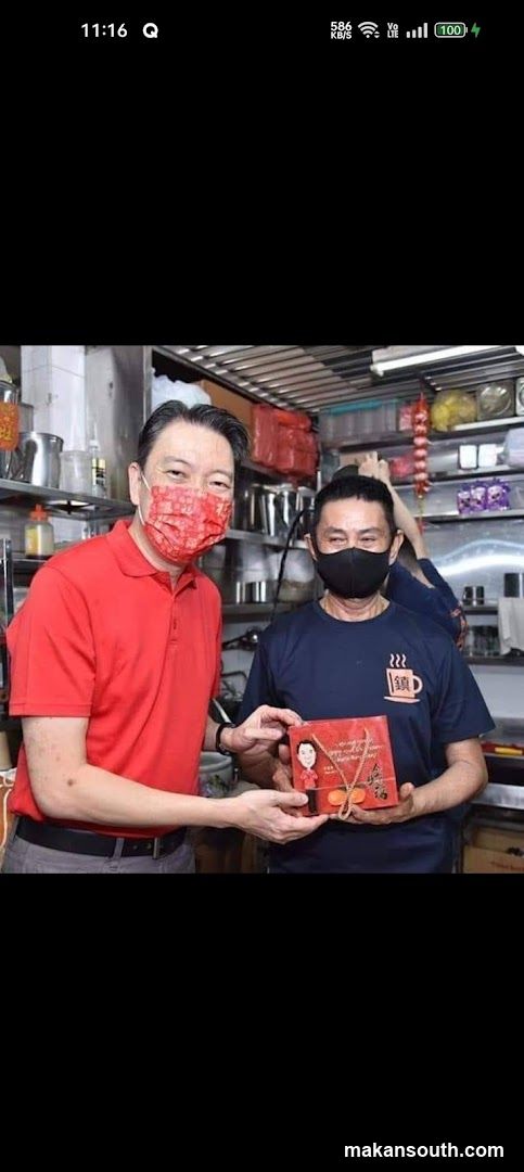 Two men exchanging a gift box