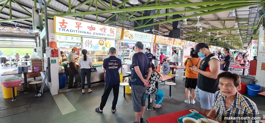 Busy food court with many stalls and customers