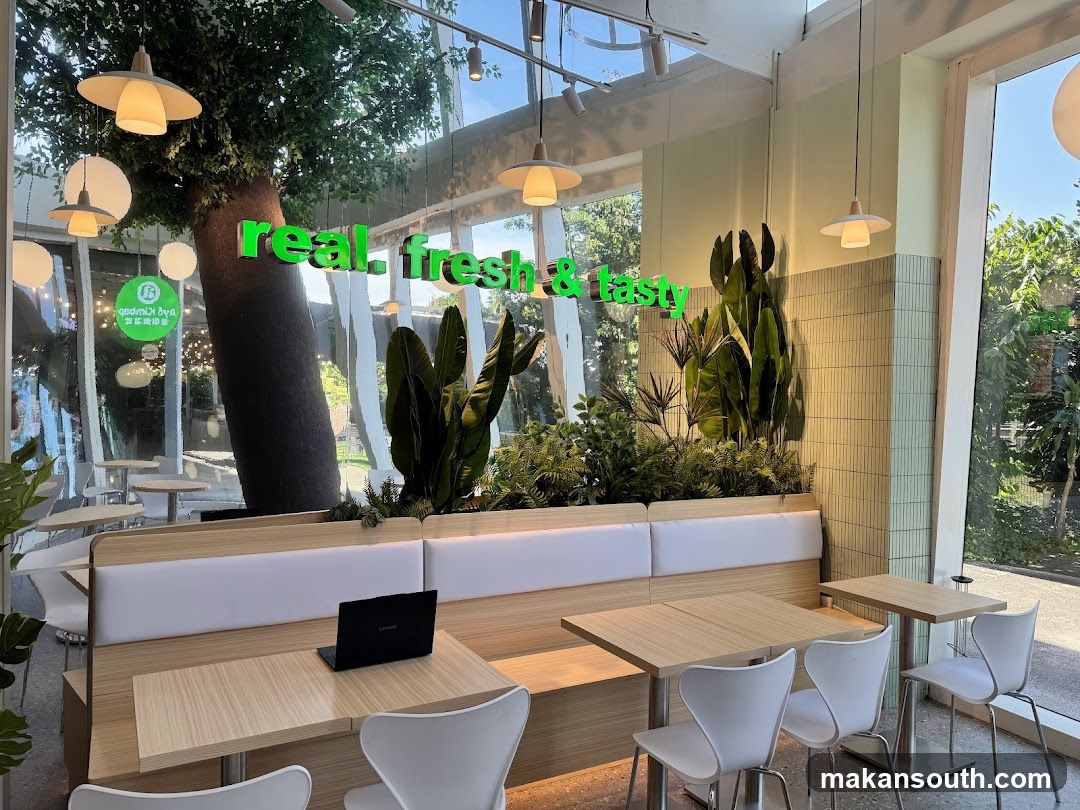 Modern cafe interior with green accents