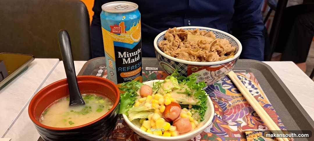 Beef bowl meal with orange drink