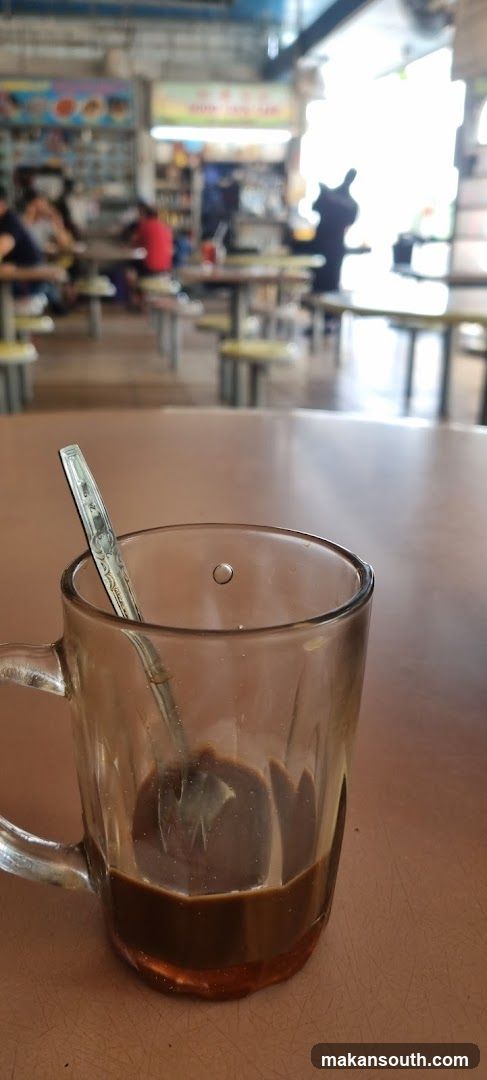 Coffee in a glass mug at a hawker center