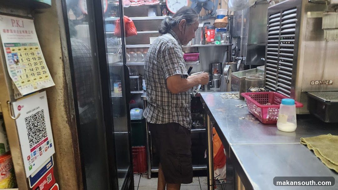 Man counting coins at a counter