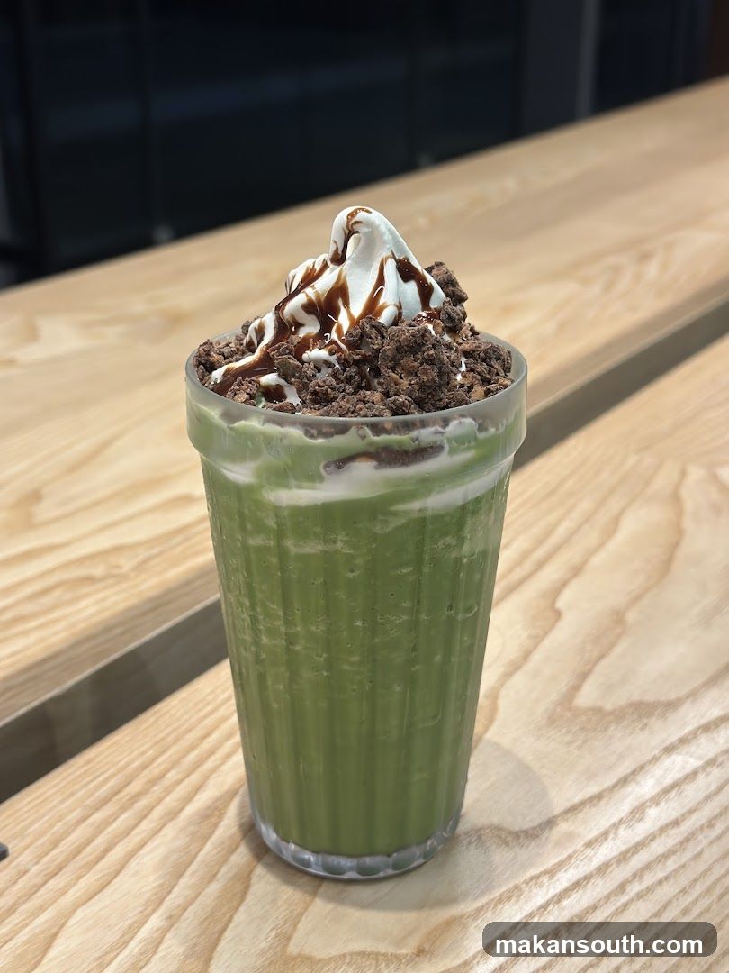 Matcha Frappe with Whipped Cream and Chocolate Drizzle