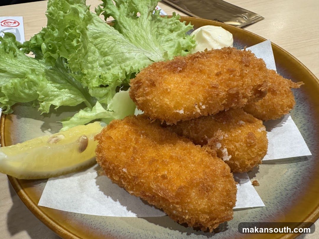 Fried Croquettes with Salad and Lemon