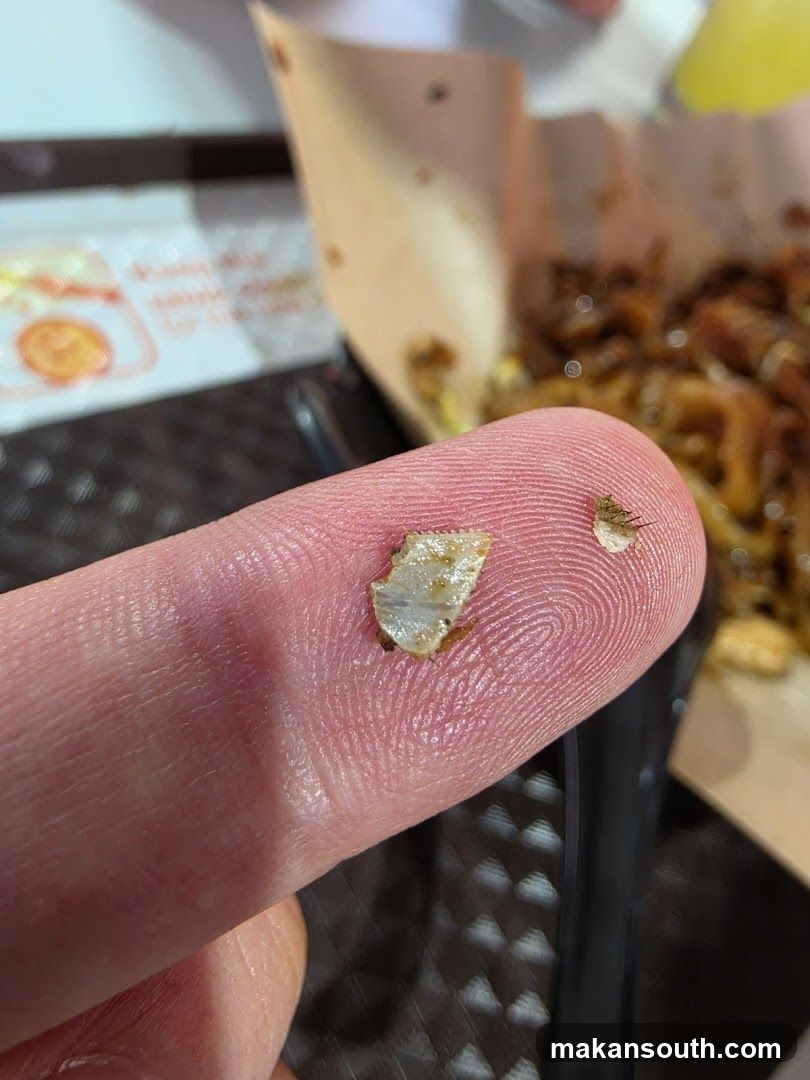 Finger with food debris