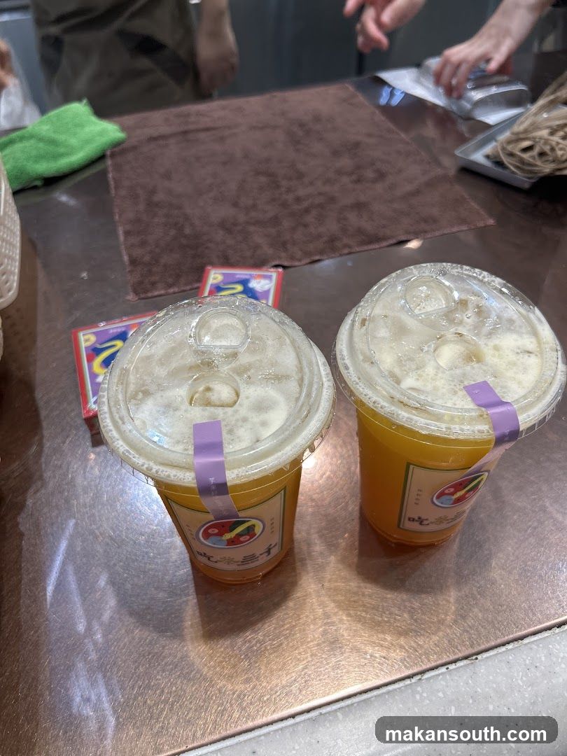 Two drinks with purple stickers