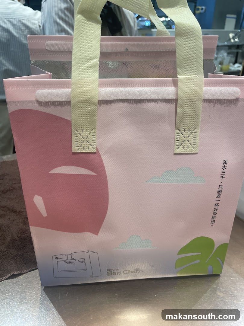 Pink tote bag with cartoon clouds and leaves