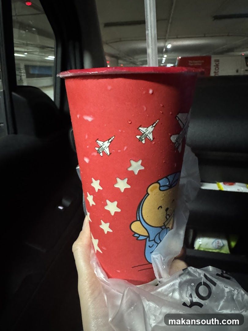 Red cup with cartoon design