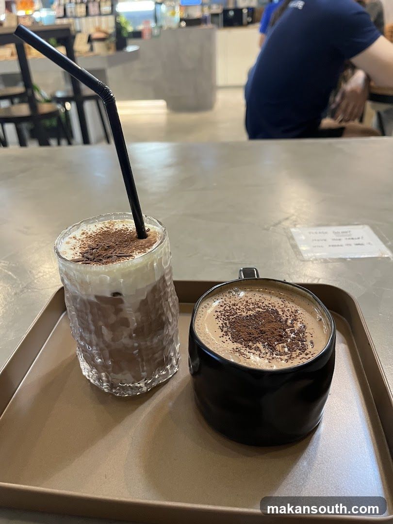 Two chocolate drinks on a tray